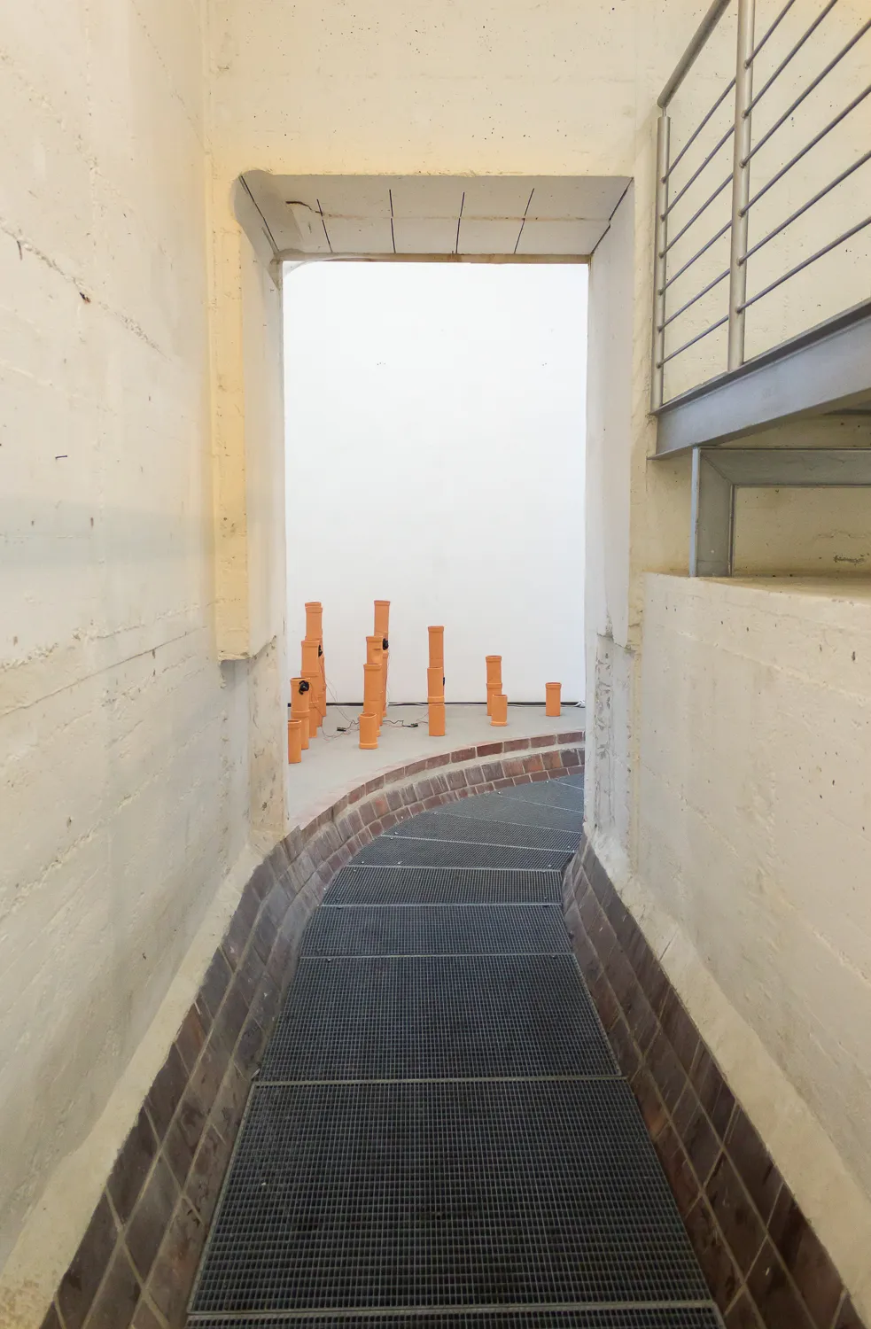 The view of the pipe arrangement seen from the hallway leading to the room.