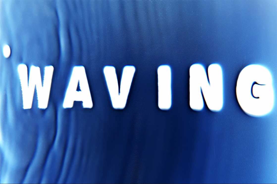 The text 'WAVING' in white on a bluebackground with ripples running through it like water.